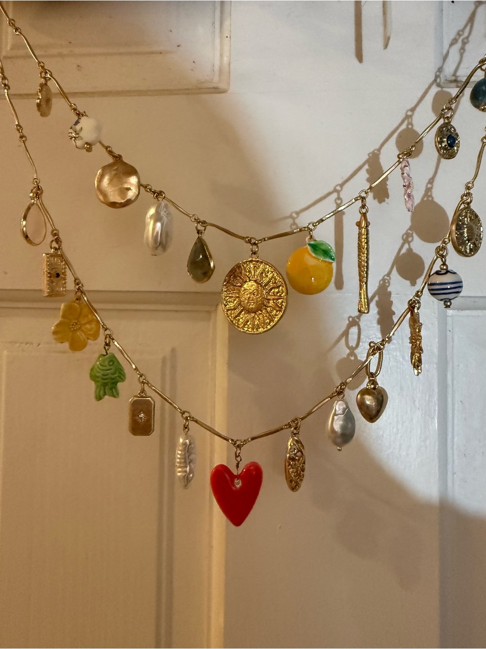 Atterri Gold Charm Statement Necklace with Red Heart and Enamel Accents